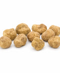 Medium-size fresh Tuber magnatum white truffles with pale ochre surfaces and natural shape variation