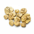 Fresh Tuber magnatum white truffles with naturally irregular pale ochre surfaces
