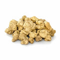 Fresh huge-size Tuber magnatum white truffles with naturally irregular pale ochre surfaces