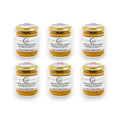 Porcini mushroom and white truffle cream jars with gold lids and labels on white background