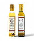 Two bottles of Terra Ross black and white truffle-flavoured olive oil