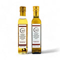 Two bottles of Terra Ross black and white truffle-flavoured olive oil